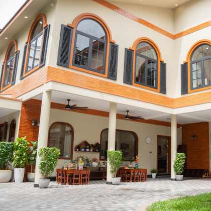The renovated Orange Crest Preschool building: two storeys of arched windows above the covered ground-floor arcade